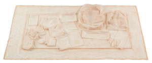 Tactile latex cast of a desk surface and objects by Herbert Stattler, capturing the physical traces, folds, and deformations of a workspace in a flexible, translucent material.